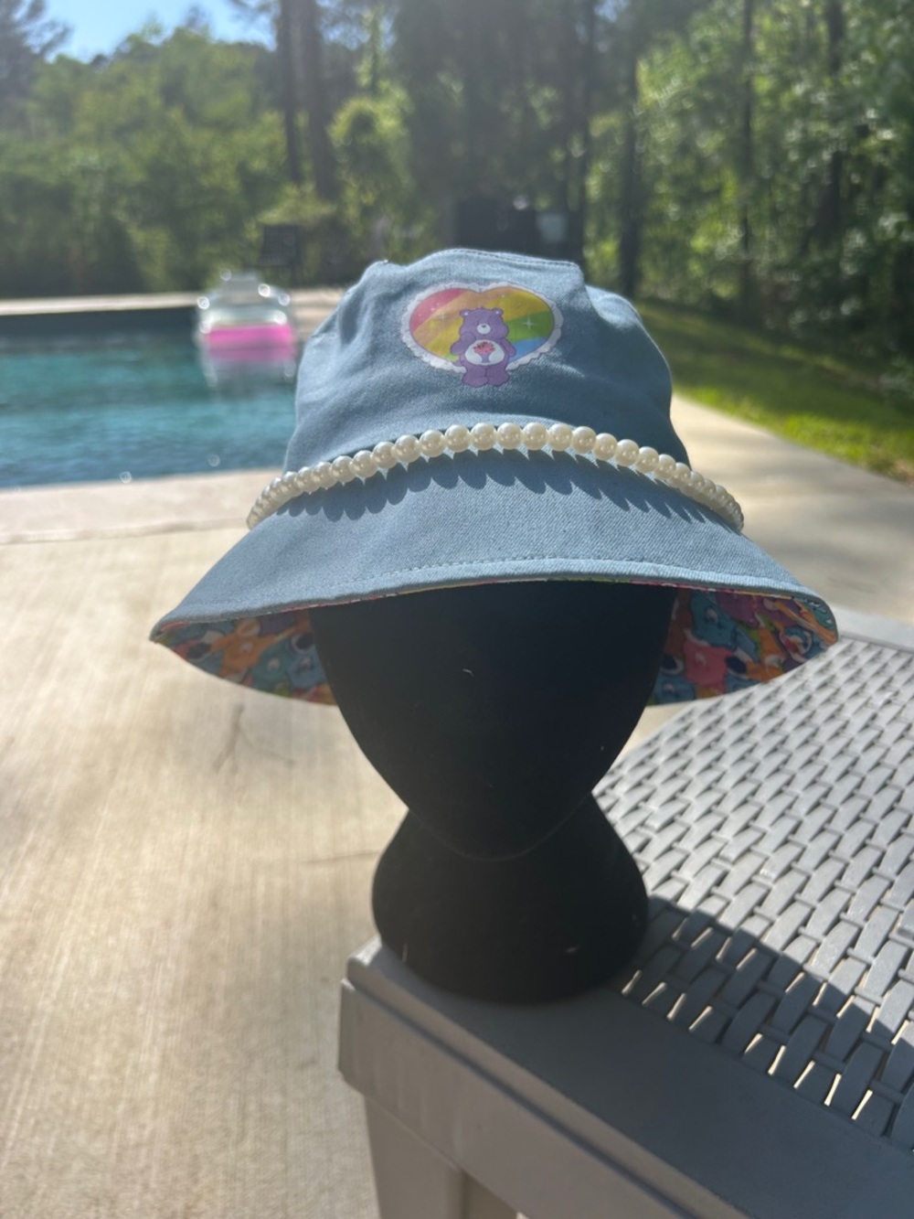 SHEIN Blue Reversible Bucket Hat with Pearl Trim and Rainbow Care Bear Patch